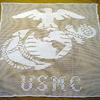 White hand crocheted item, made by Roz Beard. She worked on this many hours. It measures 28x28 inches.