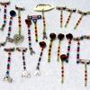 The items in the photo are pins with Swarovski crystals on drop pins. The EGA's are 10k and sterling, there is one with abalone shell and with the word MOTHER. Made by Richard Beard.