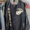 New with the tags hanging! Great Leather and Gaberdine w/EGA's and Marines on the sleeve and a HUGE EGA on the back. Size: large. Anonymous donor.