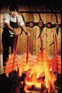 Salmon, baked around alder wood fires on cedar stakes